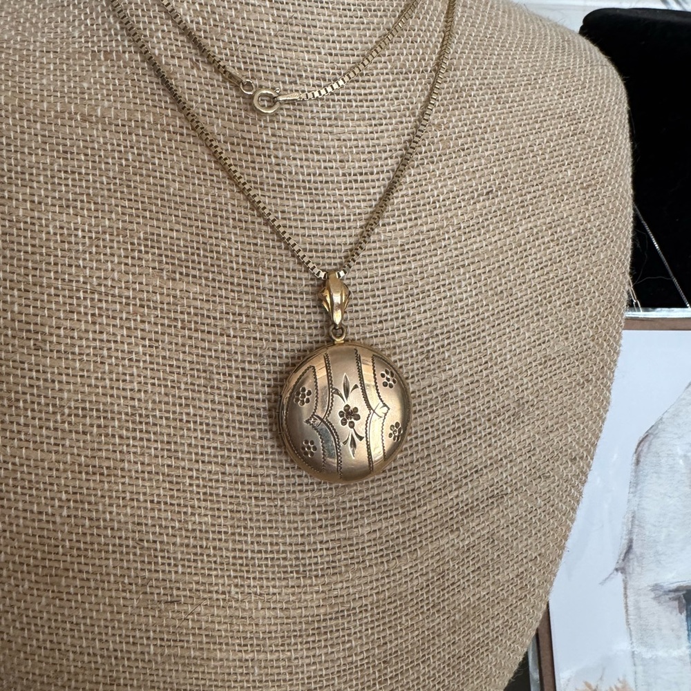 Antique round etched locket with newer box chain 30 inches yellow gold fill.